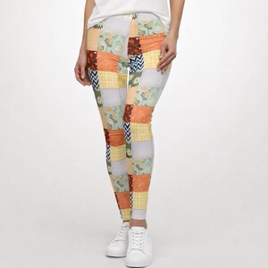 May include: Patchwork leggings in a variety of colors and patterns, including floral, geometric, and solid squares. The leggings are a mix of light blue, yellow, orange, and brown. The leggings are paired with white sneakers.