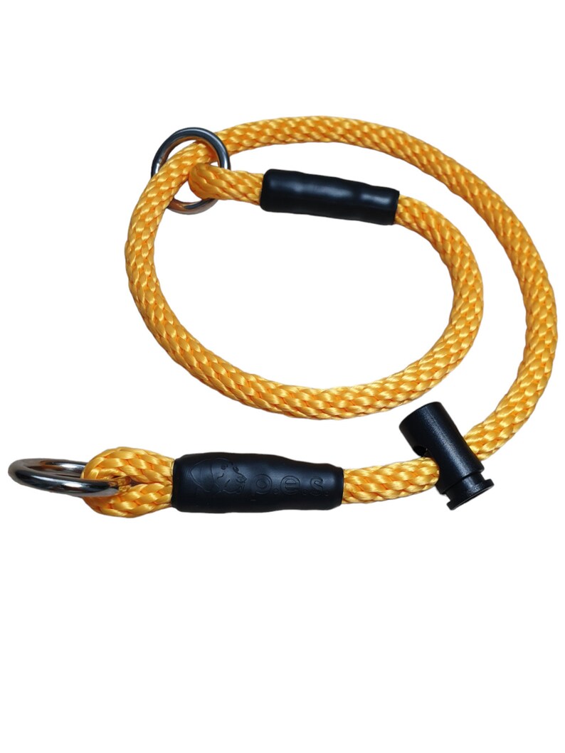 May include: Yellow rope dog collar with black rubber accents and a silver metal ring.
