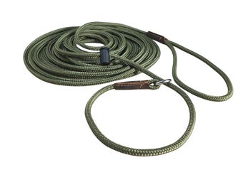 Correa larga de adiestramiento para perros: cuerda de PP de 6 mm con ribete de cuero y tope ajustado.