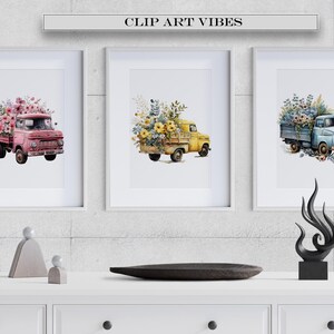 May include: Three framed watercolor paintings of vintage trucks filled with flowers. The trucks are pink, yellow, and blue. The flowers are pink, yellow, and blue. The paintings are hanging on a gray brick wall.