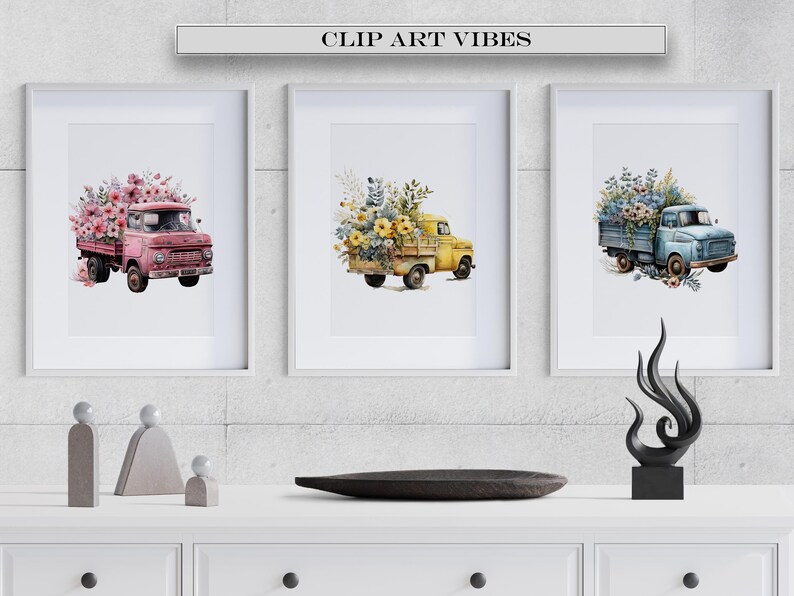 May include: Three framed watercolor paintings of vintage trucks filled with flowers. The trucks are pink, yellow, and blue. The flowers are pink, yellow, and blue. The paintings are hanging on a gray brick wall.