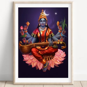 May include: A framed print of a Hindu deity, depicted with multiple arms and blue skin, seated on a pink lotus flower. The deity wears red and gold clothing, a jeweled crown, and holds various objects. A crescent moon and star are visible in the background.