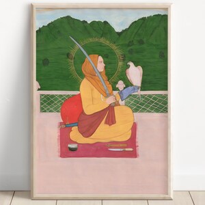 May include: Framed print of a traditional painting. A person in yellow and orange clothing sits cross-legged, holding a sword and a white bird. A halo surrounds the person's head. The background features green hills and a light pink surface.