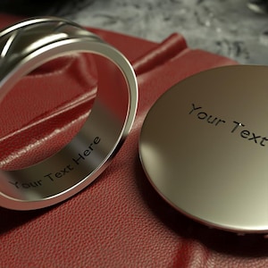a couple of rings sitting on top of a red surface