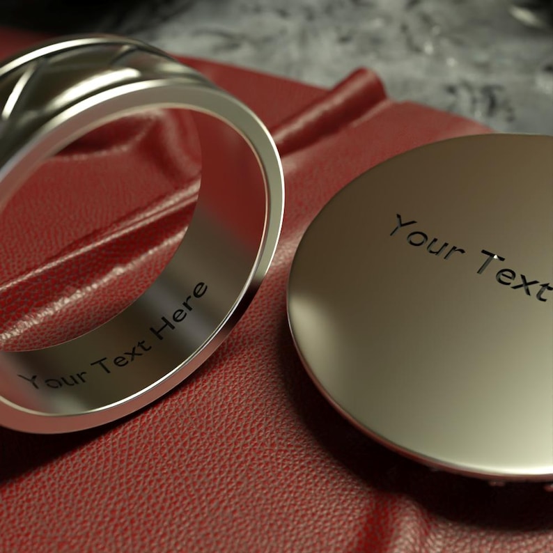 a couple of rings sitting on top of a red surface