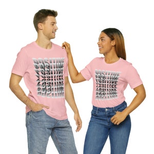 May include: Two people wearing pink t-shirts with the word "POSITIVE" printed in a gradient design. The word is repeated multiple times, with each repetition slightly offset from the previous one, creating a visual effect of depth.