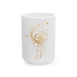 May include: A white ceramic mug featuring a gold-colored graphic design of a spiral pattern composed of thin lines, dots, and arrows. The intricate geometric illustration is centered on the front of the cylindrical vessel, which has a smooth finish.