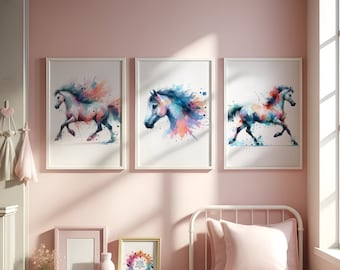 May include: Three framed wall art prints featuring watercolour-style horses in shades of blue, pink, and orange. Two additional empty frames and a small framed print with the text HB DESIGN are displayed on a white storage unit with pink bins.
