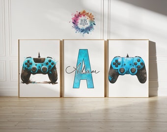 May include: Three framed prints featuring a gaming theme. Two prints display a blue and black watercolor-style video game controller. The central print showcases a large blue letter "A" with the name "Adam" in cursive.