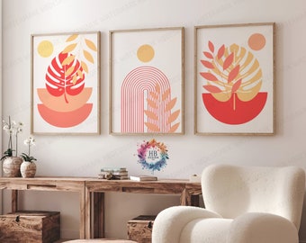 Könnte beinhalten: Drei abstrakte Kunstdrucke mit modernem minimalistischem Design. Die Drucke zeigen ein Pfirsich- und Rotfarbschema mit geometrischen Formen und Blattmotiven. Die Drucke werden an einer weißen Wand über einem Holztisch und einem weißen Stuhl ausgestellt.
