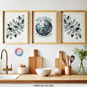 May include: Three framed prints with a kitchen theme. The center print features a green disco ball with the text "This Kitchen is for Dancing". The prints on either side feature watercolor illustrations of green leaves.