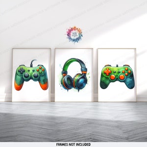 May include: Three watercolor illustrations of gaming accessories. The first illustration shows a green and orange video game controller. The second illustration shows a pair of green and blue headphones. The third illustration shows a green and orange video game controller.