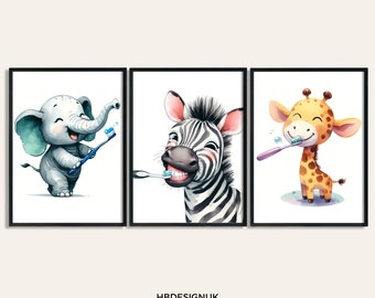 Puede incluir: Un conjunto de tres láminas artísticas enmarcadas con ilustraciones en acuarela de un elefante gris, una cebra blanca y negra y una jirafa amarilla y marrón, cada una cepillándose los dientes. El texto HBDESIGNUK ART PRINTS ON ETSY aparece debajo.