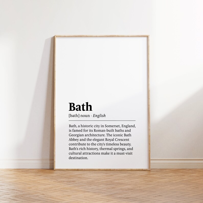 May include: A black and white printable poster with the definition of the word "Bath" in English. The poster features the text "Bath [bath] noun - English Bath, a historic city in Somerset, England, is famed for its Roman-built baths and Georgian architecture. The iconic Bath Abbey and the elegant Royal Crescent contribute to the city's timeless beauty. Bath's rich history, thermal springs, and cultural attractions make it a must-visit destination."