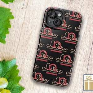 May include: Black phone case with a repeating pattern of the word "Libra" in a gold script font with a red line underneath. The word "diplomatic", "charismatic", and "clever" are written in smaller gold script font underneath the word "Libra".