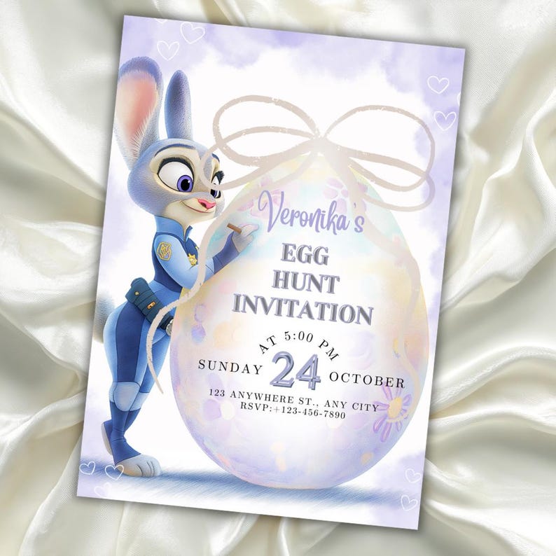 May include: A purple and white invitation card with a cartoon bunny character and an egg design. The card reads "Veronika's Egg Hunt Invitation" with event details, including the date and time. The bunny is wearing a police uniform.
