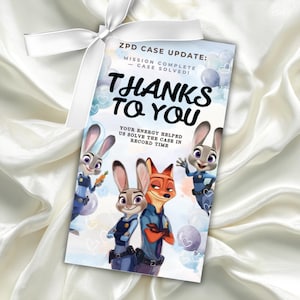 May include: A Zootopia-themed gift tag with a white ribbon. The tag features Judy Hopps and Nick Wilde, along with the text "THANKS TO YOU". The tag reads "ZPD CASE UPDATE: MISSION COMPLETE - CASE SOLVED!" and "YOUR ENERGY HELPED US SOLVE THE CASE IN RECORD TIME."