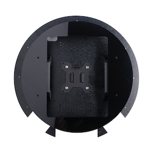 May include: Black circular case with a mounting bracket for a device. The case has a textured surface and a smooth, glossy rim.