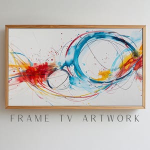Könnte beinhalten: Abstrakte Aquarellmalerei mit Holzrahmen. Das Kunstwerk zeigt dynamische Wirbel aus blauer, roter und gelber Farbe auf weißem Hintergrund. Der Text "FRAME TV ARTWORK" ist unten zu sehen.