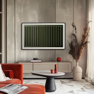 May include: A modern living room interior with a large flat screen TV displaying a green abstract image, a red sofa, a wooden cabinet with a white top, a round coffee table with a white top and black base, a vase with dried flowers, and a red bowl on the cabinet.