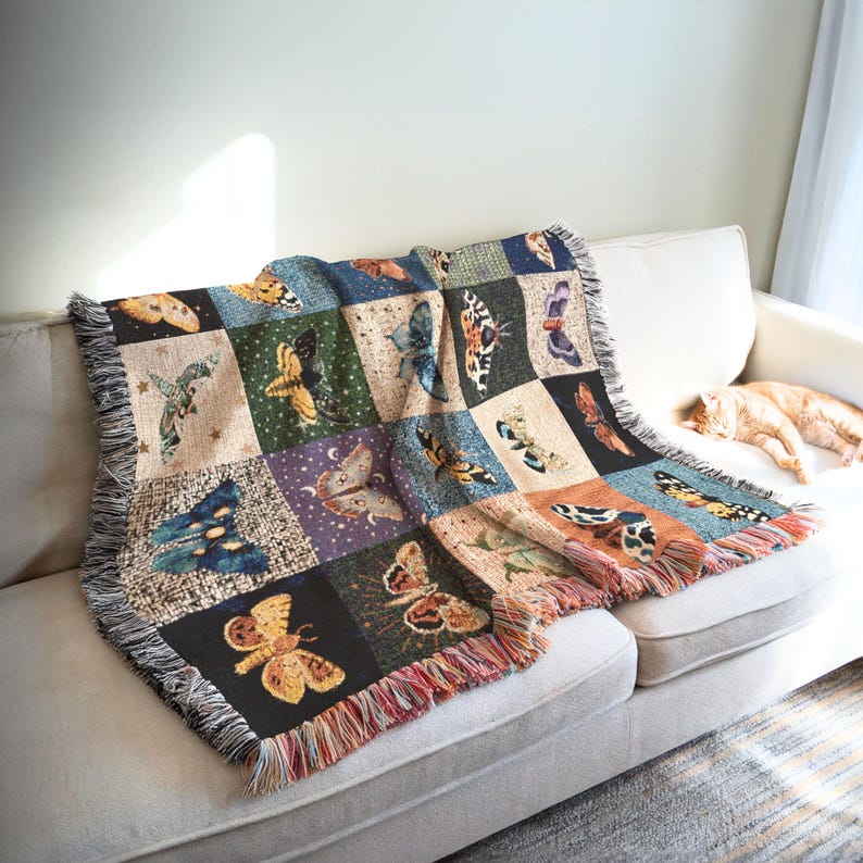 Stunning celestial moth woven blanket featuring checkerboard design each with it's own faux textured fabric square, some have stars too.  Each square has it's own moth design.   Making this an perfect blanket for anyone who loves withcy aesthetics.  Comes in 3 sizes.   See our moon woven blanket in our shop!