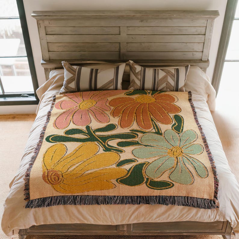 Boho flower woven blanket with vintage large floral design in earthy tones.  Showns 4 large flowers in retro style design in earth tone colors.  Perfect as  tapestry, throw for sofa, bed, or wall hanging,  Beige color shown here being used as bed spread.