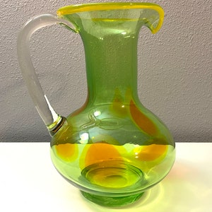 Vintage Light Green Glass Pitcher with Colorful Orange and Yellow Accents