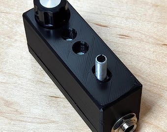 Atenuador MONO de 1/4" con interruptor de atenuación de 10 y 20 dB, ajustable
