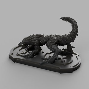 May include: A black, detailed, 3D printed figurine of a creature with a long tail, standing on a circular base with a geometric design.