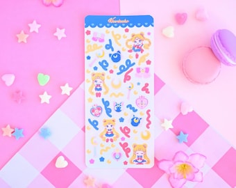 May include: A sheet of stickers featuring a cartoon character with a pink, blue, and yellow color scheme. The character is surrounded by stars, hearts, and other decorative elements. The text "Kawaii-neko" is printed in the top left corner of the sheet.
