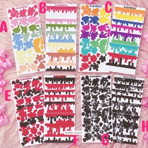 May include: A set of 8 colorful sticker sheets featuring various designs. The sheets include dripping paint designs in rainbow colors, black and white splatters, and black and white dripping paint designs. The sheets are labeled "KawhiNeko" and "KawhiNeko Studio".