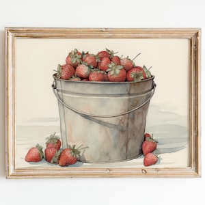 May include: A watercolor painting of a metal bucket filled with red strawberries. The bucket is sitting on a white surface with a few strawberries scattered around it.