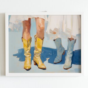 May include: Painting of two pairs of legs wearing boots. One pair is wearing yellow cowboy boots and the other pair is wearing light blue cowboy boots. The legs are wearing white dresses.