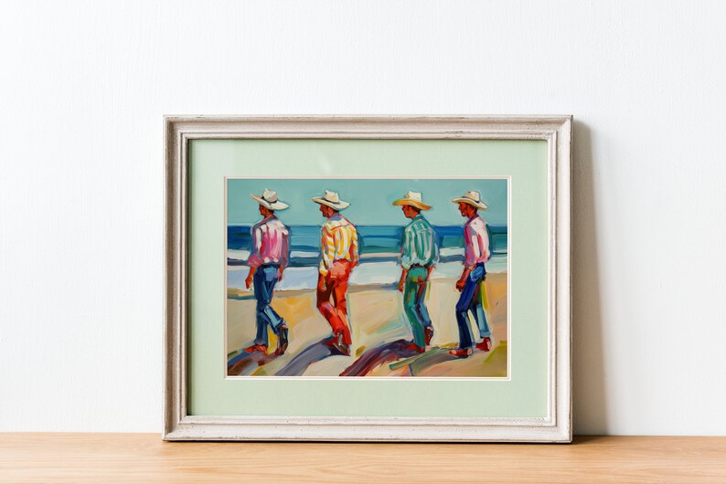 May include: Framed art print depicting four figures in hats and colorful shirts walking on a beach. The painting features a light blue sky and ocean, with the figures casting long shadows on the sand. The artwork is framed in a white wooden frame.