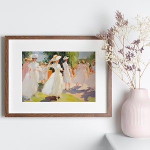 May include: A framed painting depicts a group of women in white dresses and hats dancing outdoors. The artwork has a soft, impressionistic style with a palette of whites, greens, and yellows. A pink vase with dried flowers sits nearby.