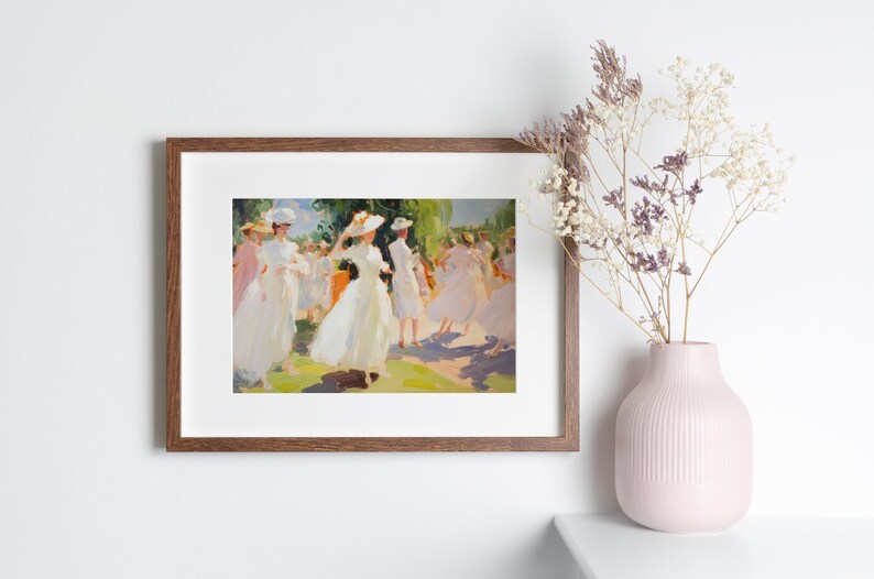 May include: A framed painting depicts a group of women in white dresses and hats dancing outdoors. The artwork has a soft, impressionistic style with a palette of whites, greens, and yellows. A pink vase with dried flowers sits nearby.