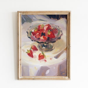 May include: A painting of a still life with a bowl of red strawberries and a few strawberries on a white tablecloth. The bowl is on a pedestal and there is a silver knife on the table.