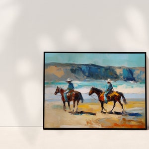 Peut inclure: Une peinture repr&eacute;sentant deux cowboys &agrave; cheval sur une plage. Les chevaux sont bruns et les cowboys portent un jean bleu et un chapeau blanc. La plage est sablonneuse et l'oc&eacute;an est bleu. L'arri&egrave;re-plan est une falaise.