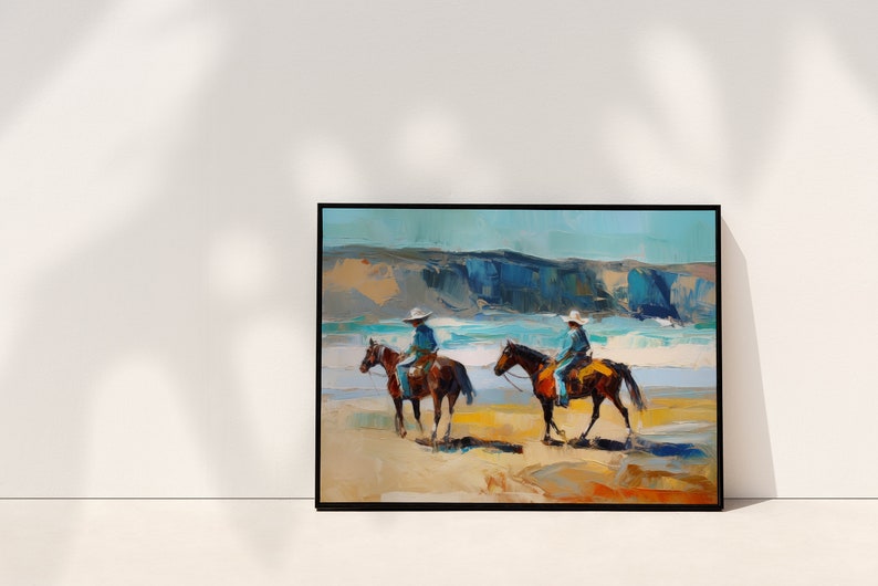 Peut inclure: Une peinture repr&eacute;sentant deux cowboys &agrave; cheval sur une plage. Les chevaux sont bruns et les cowboys portent un jean bleu et un chapeau blanc. La plage est sablonneuse et l'oc&eacute;an est bleu. L'arri&egrave;re-plan est une falaise.