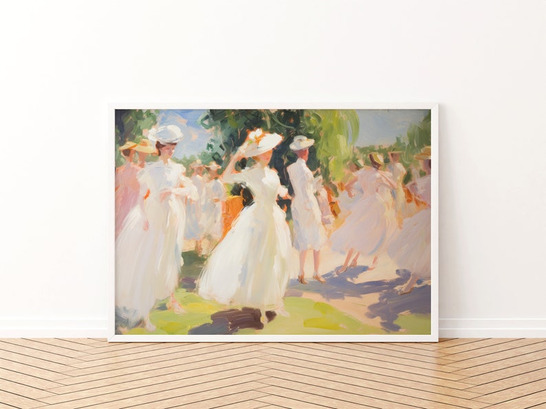 May include: An impressionistic painting of a group of people in white dresses and hats, set in a sunny outdoor scene. The artwork is framed in a white border and mounted on a wall above a wooden floor.