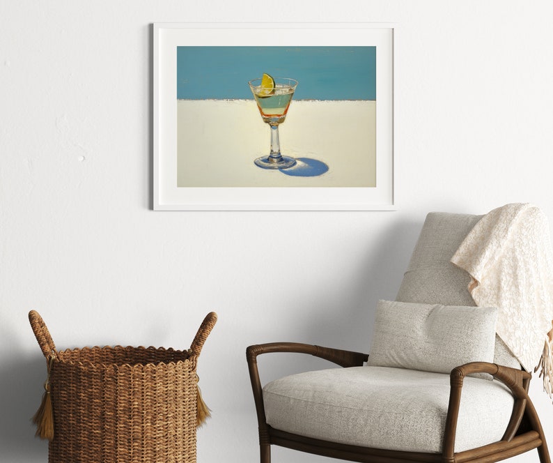 May include: A framed painting of a martini glass with a lime wedge on a white background with a blue sky in the background.