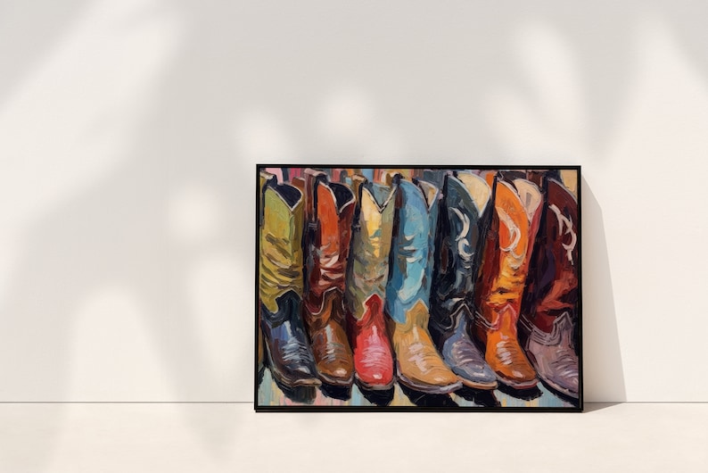 May include: A framed rectangular wall art print featuring a painted row of seven cowboy boots in various colors including yellow, red, blue, black, and orange. The painting uses visible brushstrokes to depict the leather texture and stitching.