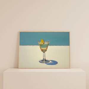 May include: A painting of a martini glass with a lime wedge on a white background with a blue sky above.
