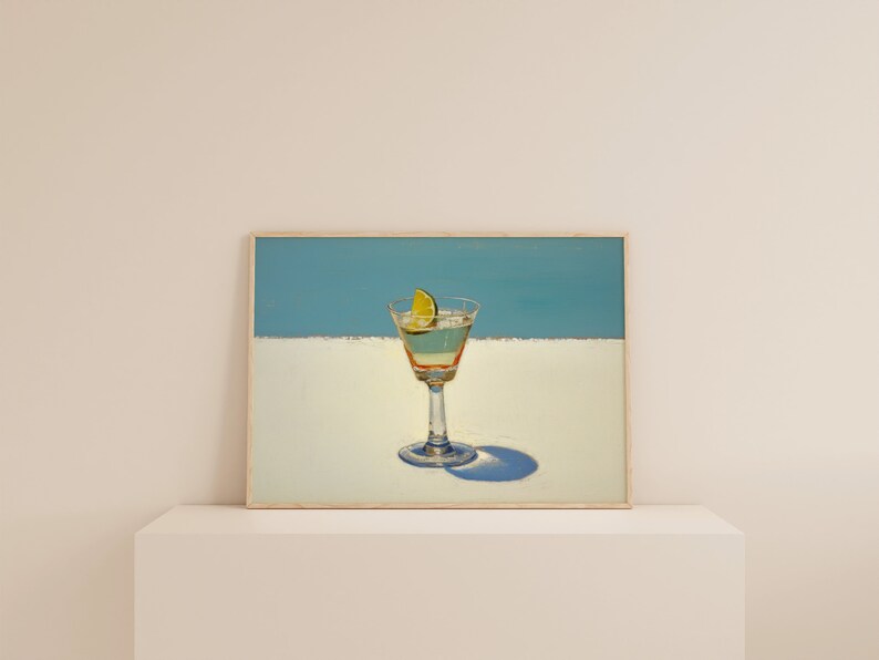 May include: A painting of a martini glass with a lime wedge on a white background with a blue sky above.