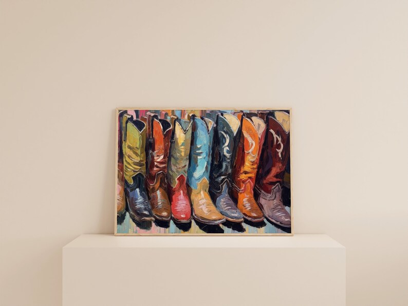 May include: A framed painting depicting a row of seven cowboy boots in various colors including lime green, orange, yellow, blue, black, and dark red. The artwork features visible brushstrokes and a textured style, showcasing the distinct shapes.