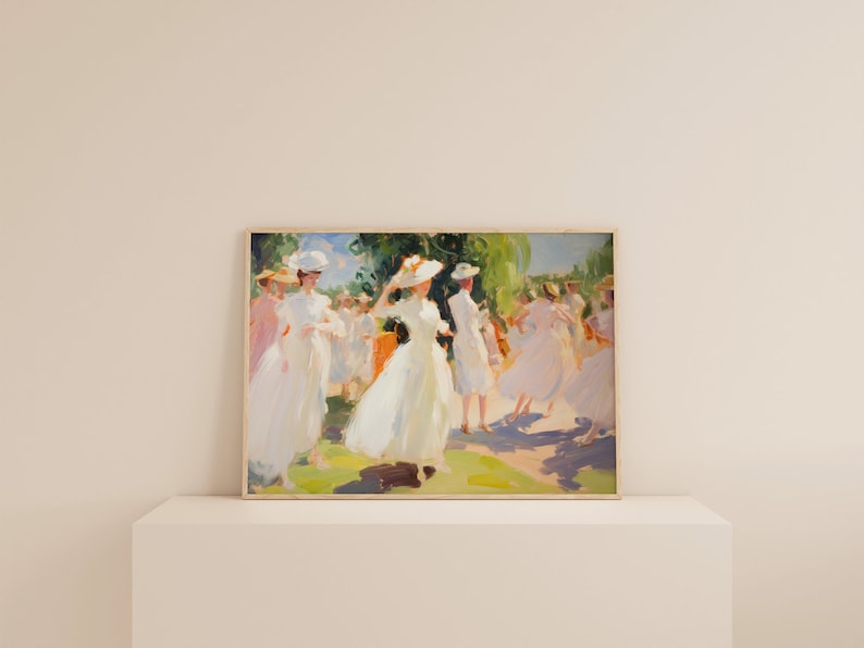 May include: A framed painting depicts a sunny outdoor scene with figures in white dresses and hats. The impressionistic artwork features a palette of soft greens, blues, and pinks, with visible brushstrokes. The figures appear to be dancing or strolling in a park.
