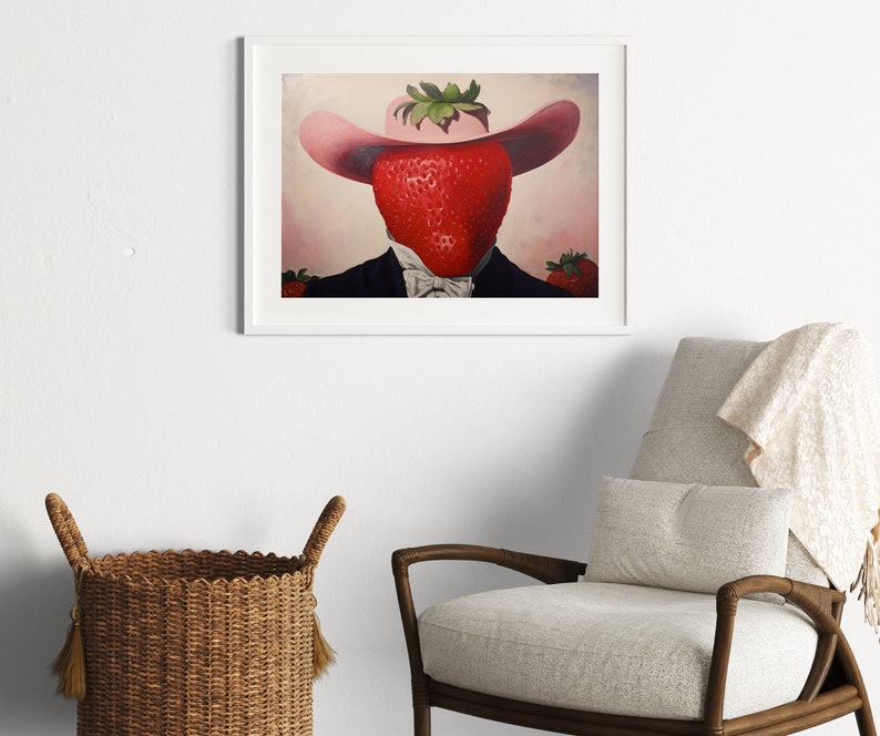 Peut inclure: Une impression d'art encadr&eacute;e repr&eacute;sentant le portrait surr&eacute;aliste d'une grosse fraise rouge portant un chapeau rose &agrave; larges bords et un costume sombre avec un n&oelig;ud papillon blanc. La fraise est centr&eacute;e, avec des fraises plus petites sur les c&ocirc;t&eacute;s.