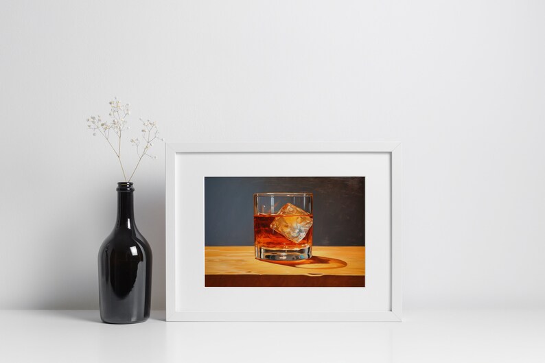 May include: A framed painting of a glass of amber liquid with an ice cube, on a wooden surface.