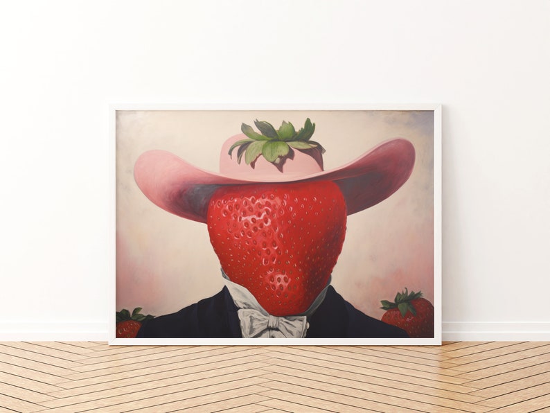 Peut inclure: Une impression d'art encadr&eacute;e repr&eacute;sentant une fraise rouge vif avec un sommet feuillu vert portant un chapeau rose &agrave; larges bords. La fraise est v&ecirc;tue d'une veste de costume noire avec une chemise blanche &agrave; col et un n&oelig;ud papillon blanc, avec deux fraises.