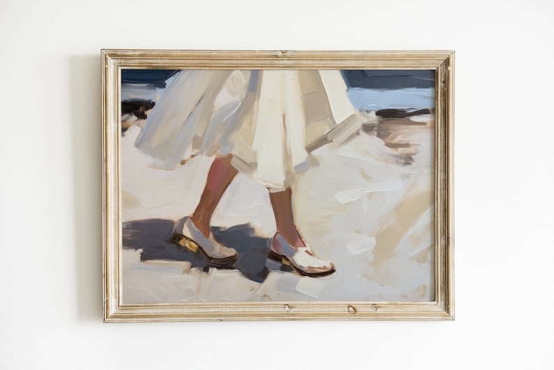 May include: Oil painting print in a gold frame. The artwork depicts a person walking, with a white dress and white shoes. The painting uses a palette of white, beige, and blue tones, creating a soft, impressionistic style.